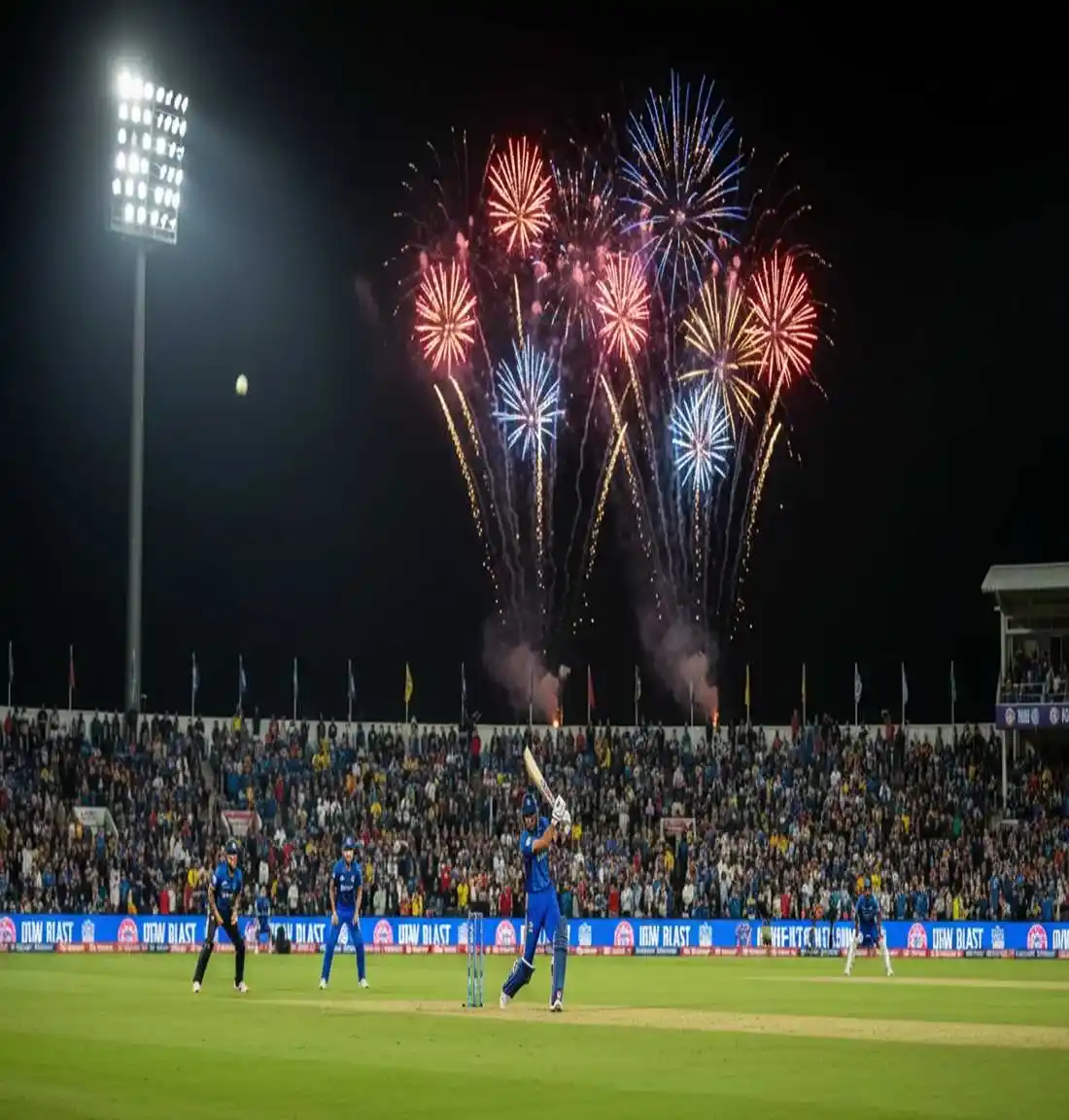 T20 Blast cricket match under floodlights with colorful crowd and exciting evening atmosphere