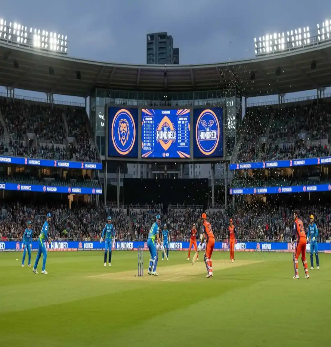 The Hundred franchise cricket match with colorful team branding and diverse modern audience